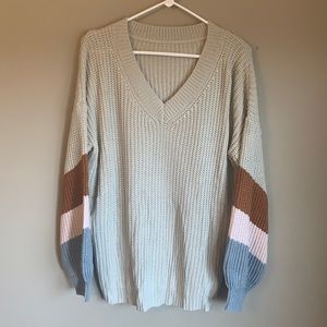 NWOT tan sweater with colorblock sleeve detail